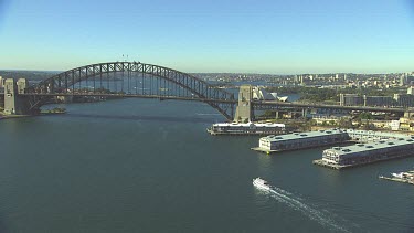 Sydney Harbour Bridge with Australian flags, North Sydney and Milson's Point. Wide shot to close up