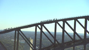 Sydney Harbour Bridge with tourists climbing bridge. Close Up.
