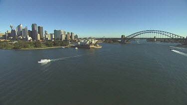Opera House, Circular Quay, Ferries, City CBD with tall office sky scrapers, Botanical Garden. The Rocks. Wide Shot.