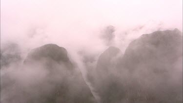Time Lapse of the mists and clouds curling around the mountains surrounding Machu Picchu