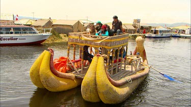 A hand made reed boat full of tourists on Lake Titicaca