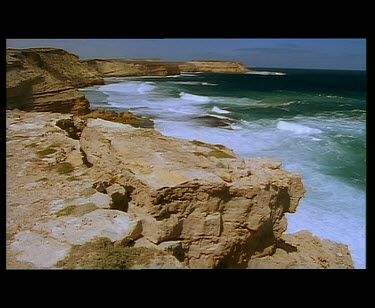 Various. Cliffs and waves. Dangerous rocky coastline. POV looking down steep cliff.