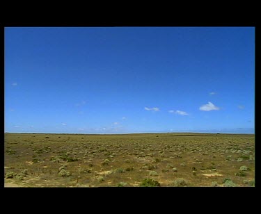 Driving on Nullarbor Plain. Road sign "Eastern end of treeless plains".