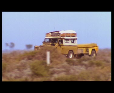 Heat haze and jeep and double motorbike driving nullarbor.