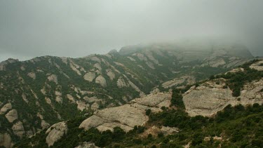 Set high on Mt Montserrat, clouds move through the mountain in this scenic timelapse. Mt Montserrat is a major tourist attraction in Spain.