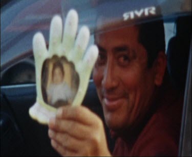 Man Showing Photo of Baby, View of Baby In Back Seat
