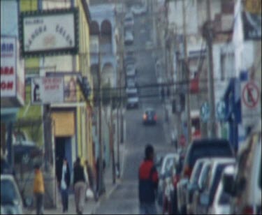 Grainy Shot Of Local Chilean Street, With Mountain Above