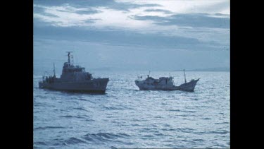Australian navy ship approaches boat of illegal clam poachers
