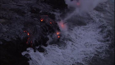 Edge of lava delta. Waves crashing on back lava beach.