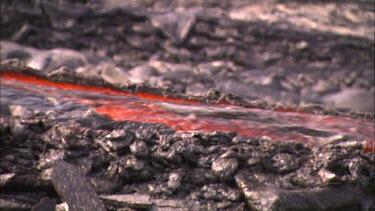Lava flowing in channel and heat haze