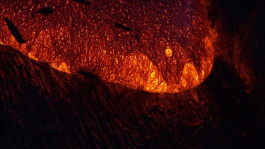 Incandescent lava seeping from a fissure.