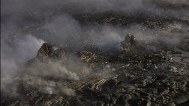 Active lava field . Day. Steam plumes.