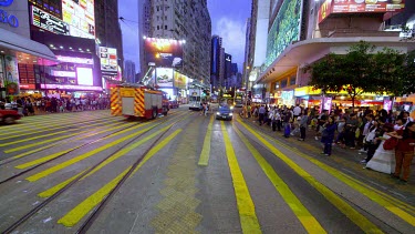 Buses, Trams & Pedestrians On Yee Wo Street, Causeway Bay, Hong Kong, China