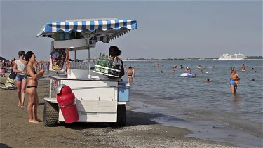 Man Selling Drinks On Beach, Lido, Venice, Italy