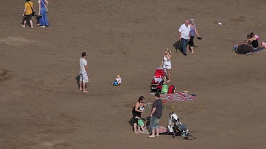 People Playing On Beach, Whitby, North Yorkshire, England