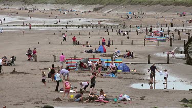 Holiday Makers On Beach, Sandsend, North Yorkshire, England