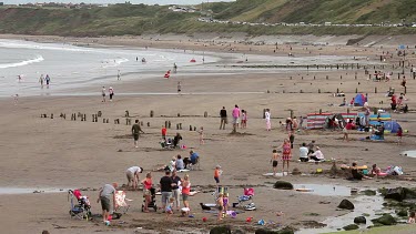 Holiday Makers On Beach, Sandsend, North Yorkshire, England