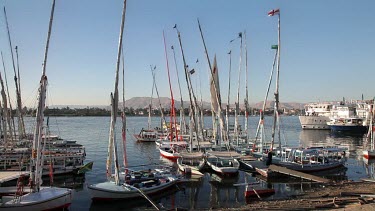 Moored Feluccas & Passenger Ferries, River Nile, Luxor, Egypt