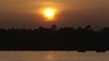 Boat Silhouette & Sunset, River Nile, Luxor, Egypt