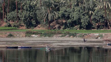 Men With Rowing Boat & Donkey, River Nile, Luxor, Egypt