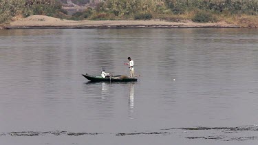 Fishermen On Rowing Boat Bringing In Nets, River Nile, Luxor, Egypt