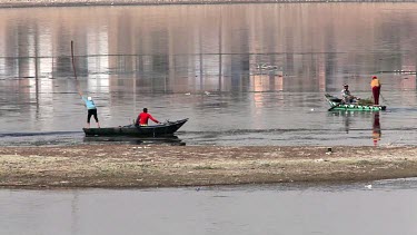 Fishermen On Rowing Boats Putting Out Nets, River Nile, Luxor, Egypt