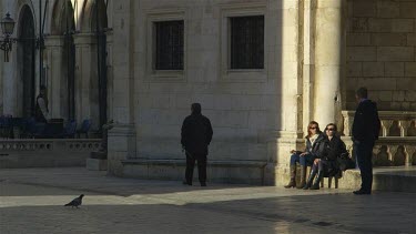 Tourist Enjoying Late Sun Outside Rectors Palace & Pred Dvorom, Old Town, Dubrovnik, Croatia