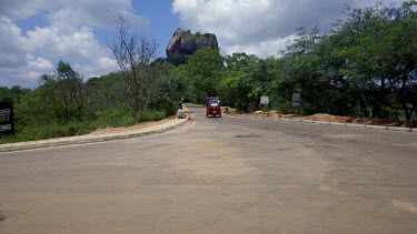 Lion Rock, Red Tuc Tuc & Cyclists, Sigiriya, Sri Lanka
