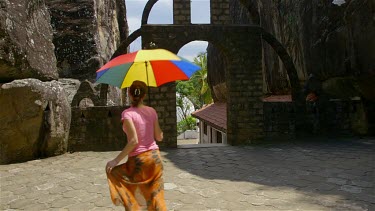 Woman Dancing With Multi-Coloured Umbrella, Aluvihara Rock Cave Temple, Matale, Sri Lanka