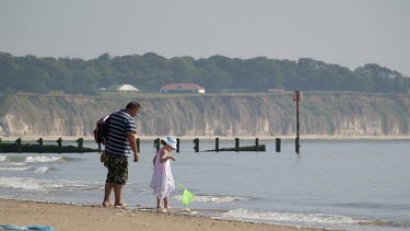Little Girl With Dad & Fishing Net, Bridlington, North Yorkshire, England