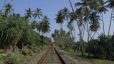 Woman Walks On Railway Line, Bentota, Sri Lanka